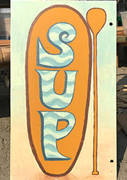 hand-painted sign for OASIS rental sup